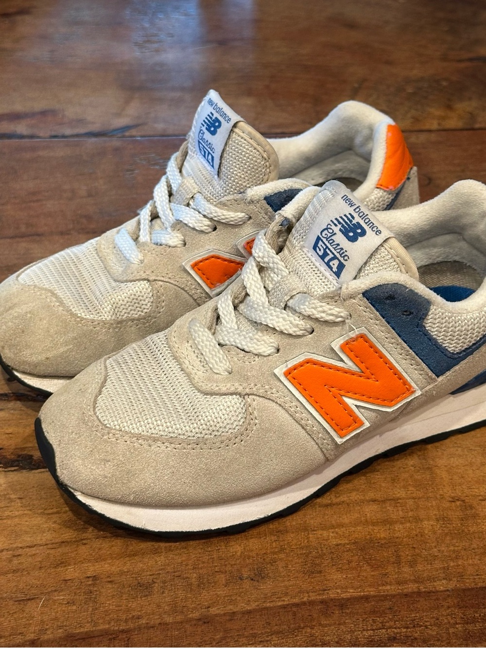New Balance Kids Beige Sneakers with Orange 'N' and Blue Accents